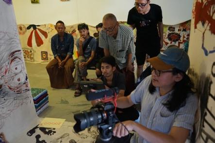 Aung MHI participants and TEN MEN crews working together at 2024 exhibition “No Trauma No Art”, filming of Yangon Midnight, a film currently developed by TEN MEN.